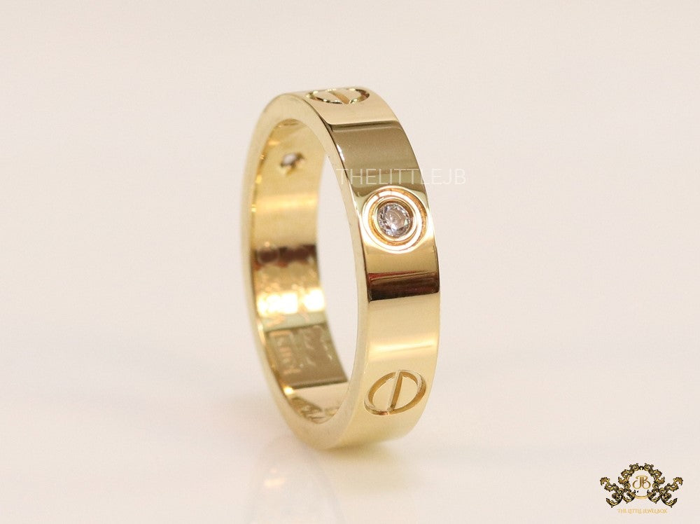 Broad 6mm gold plated band with screws and stones