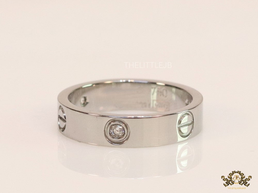 Narrow 4.5mm platinum plated band with screws and stones