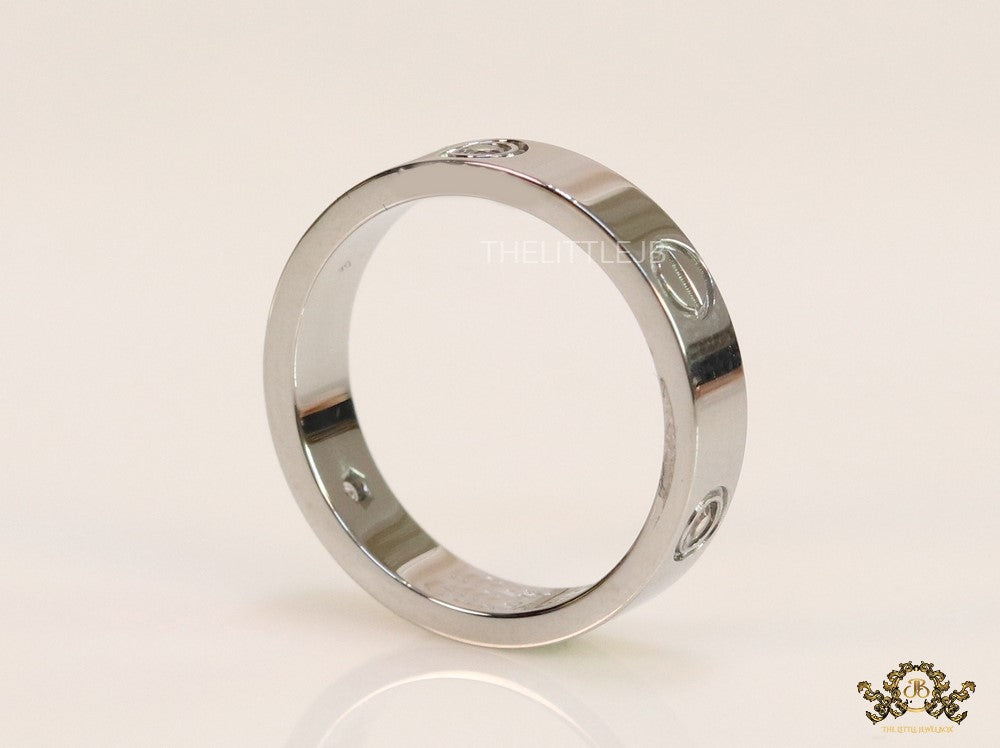 Narrow 4.5mm platinum plated band with screws and stones