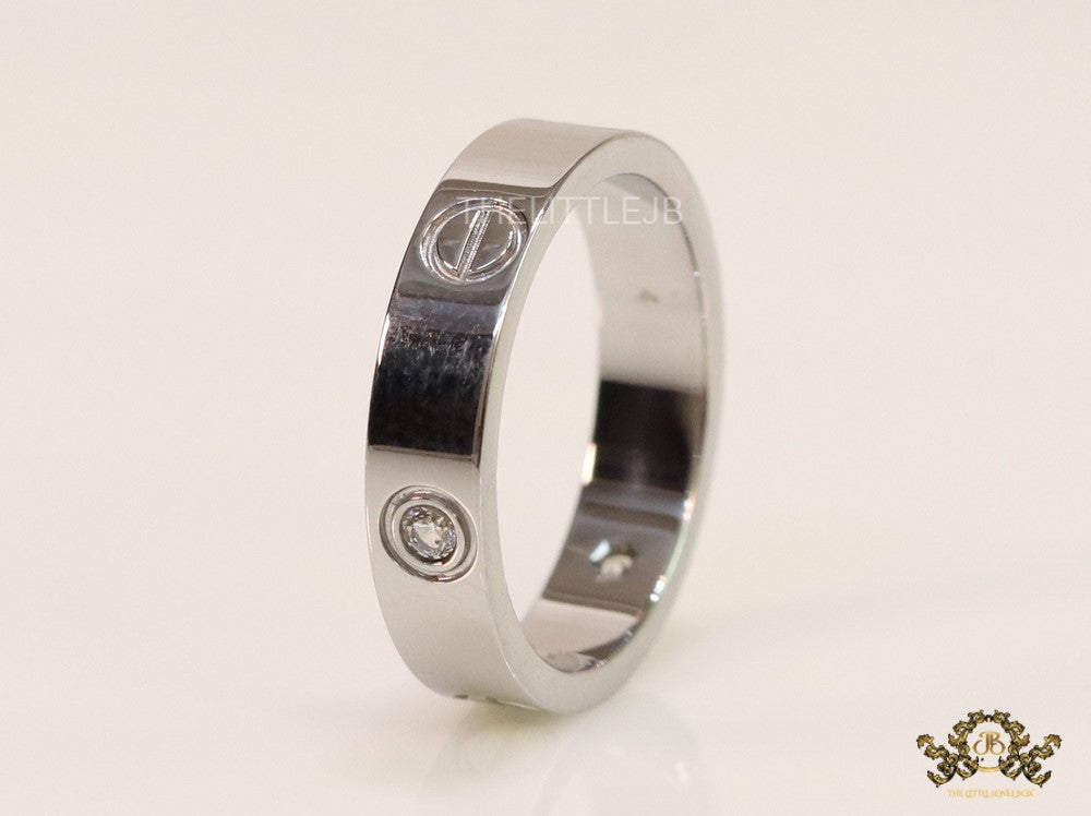 Narrow 4.5mm platinum plated band with screws and stones