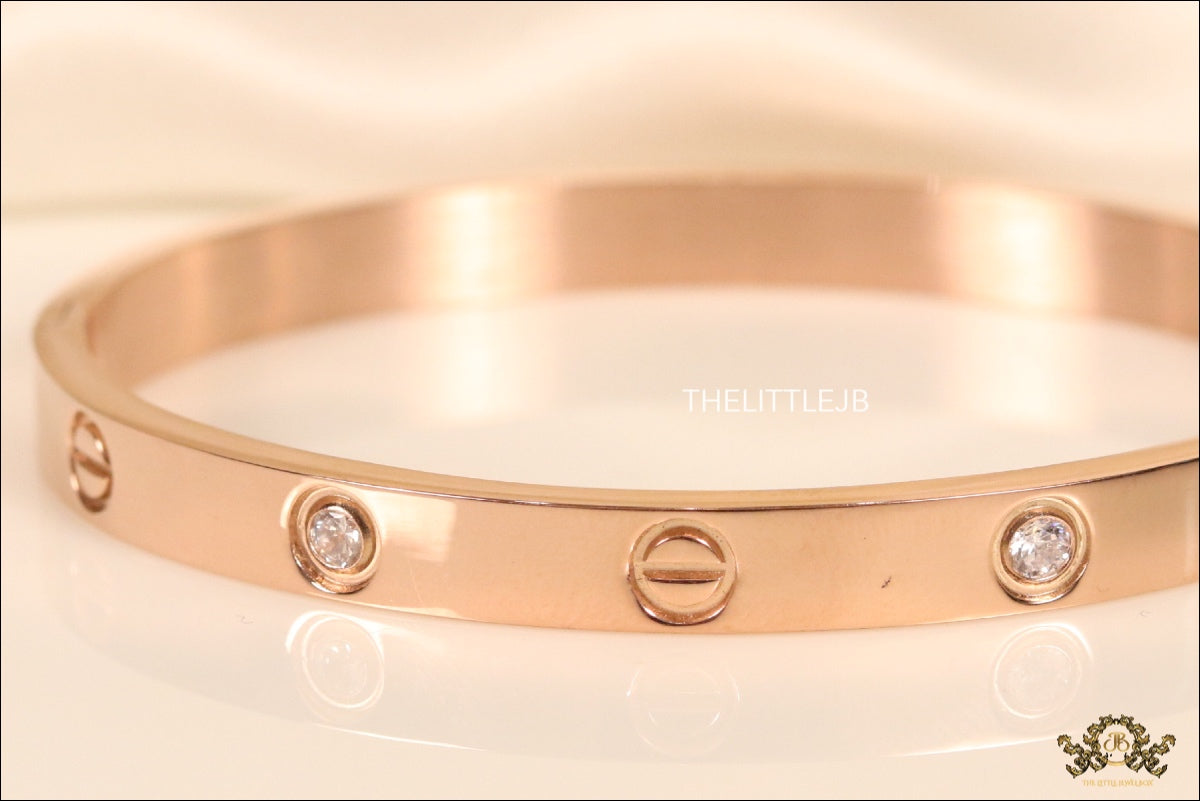 Women's Rose Gold Plated bracelet with screws and zircons