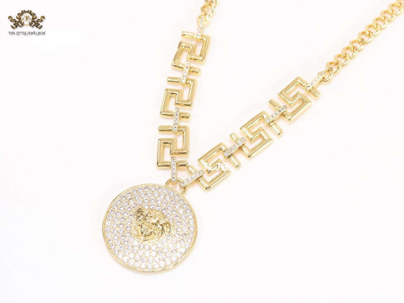 Medusa round pendant with gold link chain