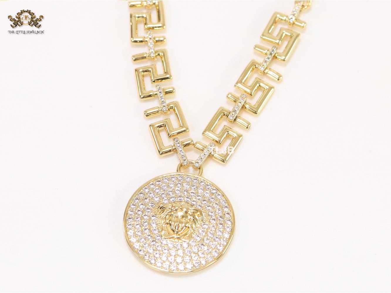 Medusa round pendant with gold link chain