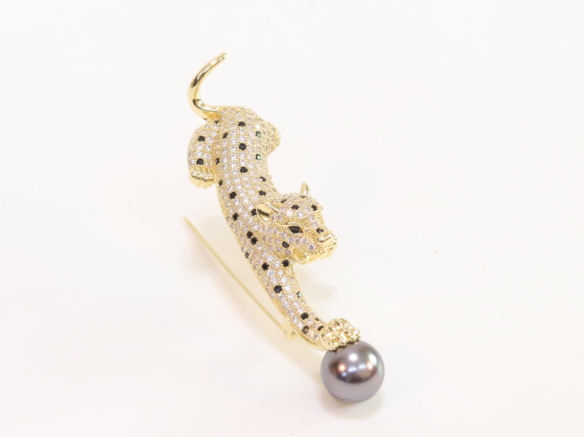 Gold panther with grey pearl and cz brooch
