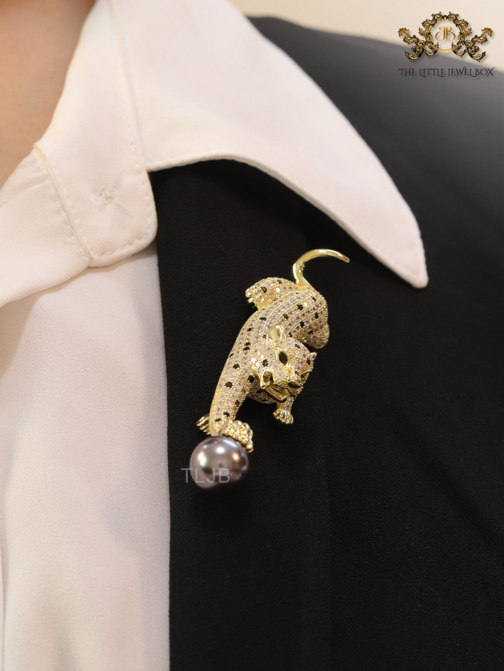 Gold panther with grey pearl and cz brooch
