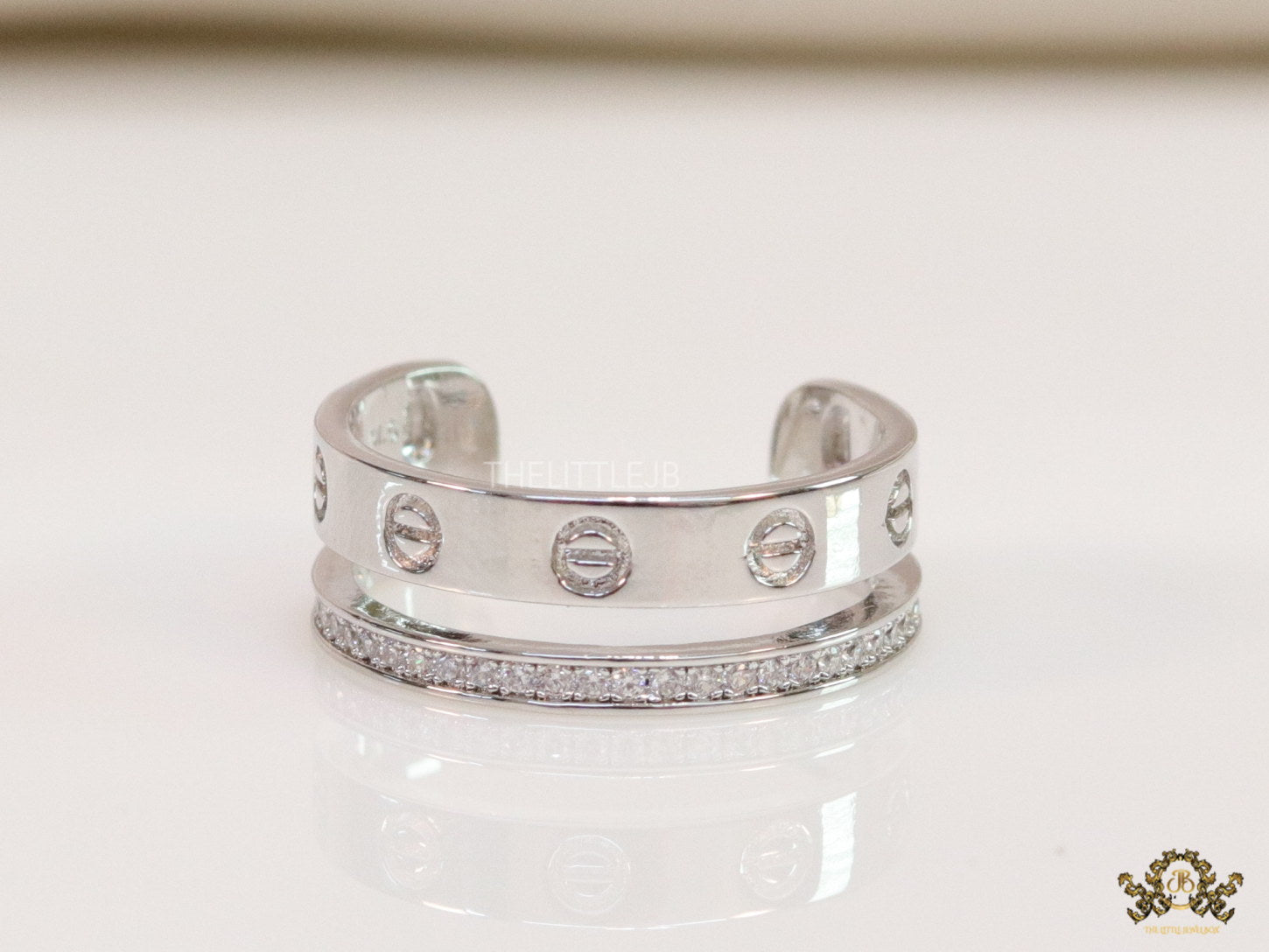 Double layered platinum plated finish open ring with screws and cz