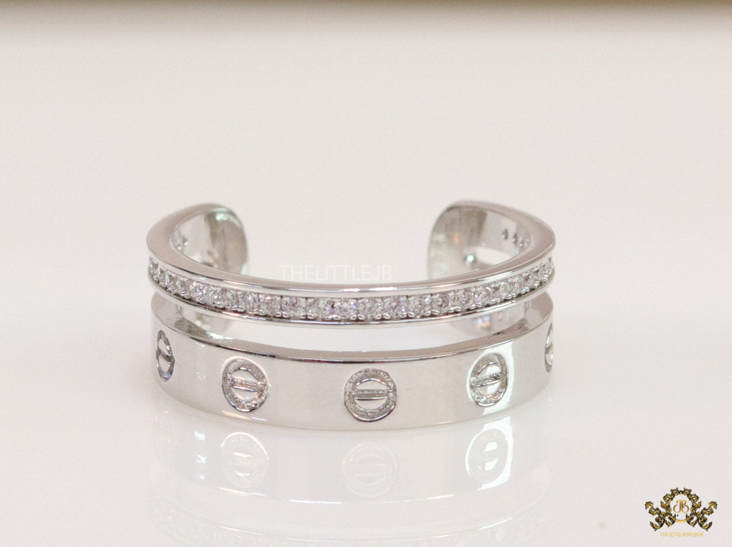 Double layered platinum plated finish open ring with screws and cz