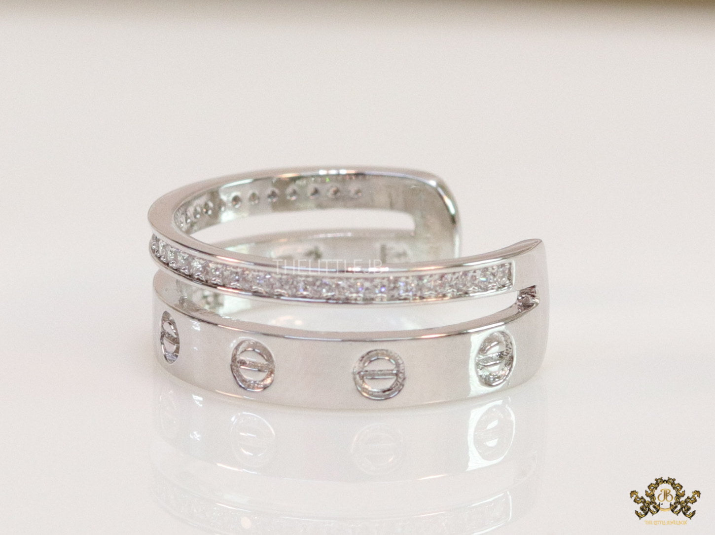 Double layered platinum plated finish open ring with screws and cz
