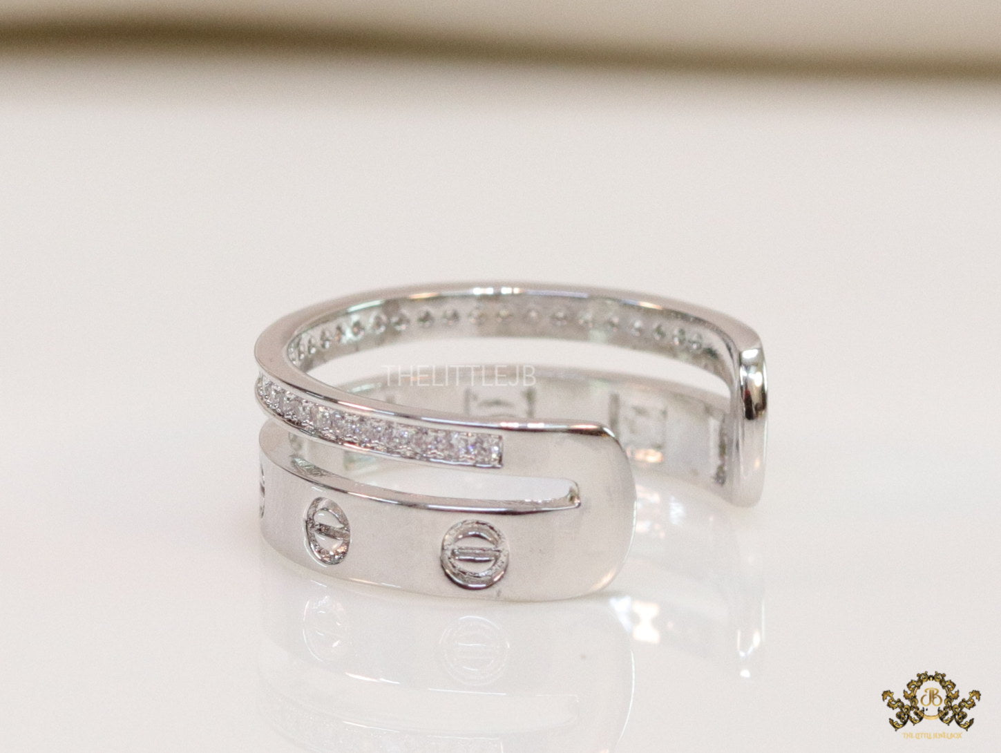 Double layered platinum plated finish open ring with screws and cz