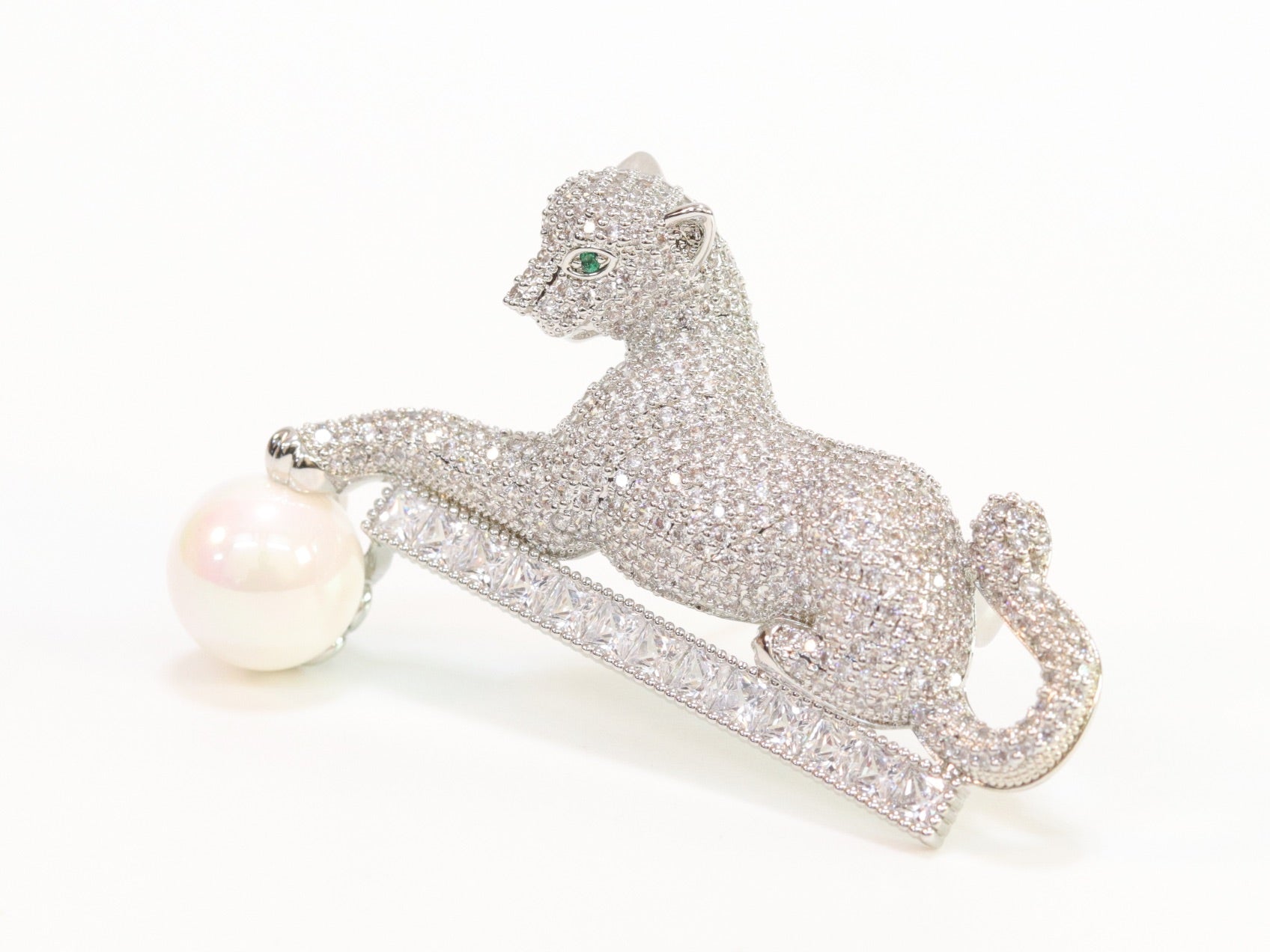Platinum panther with white pearl, cz and emerald stones brooch