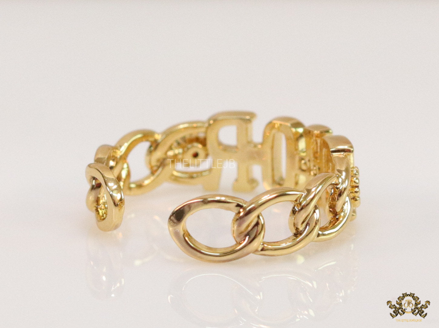 Gold plated alphabet open ring with orange cz