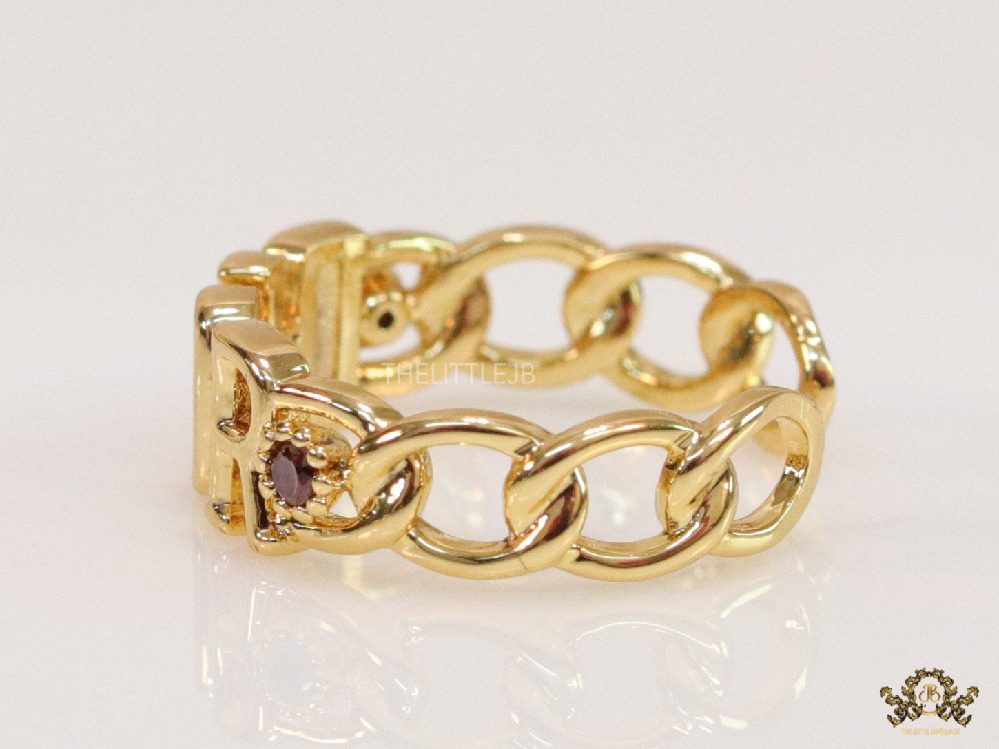 Gold plated alphabet open ring with orange cz