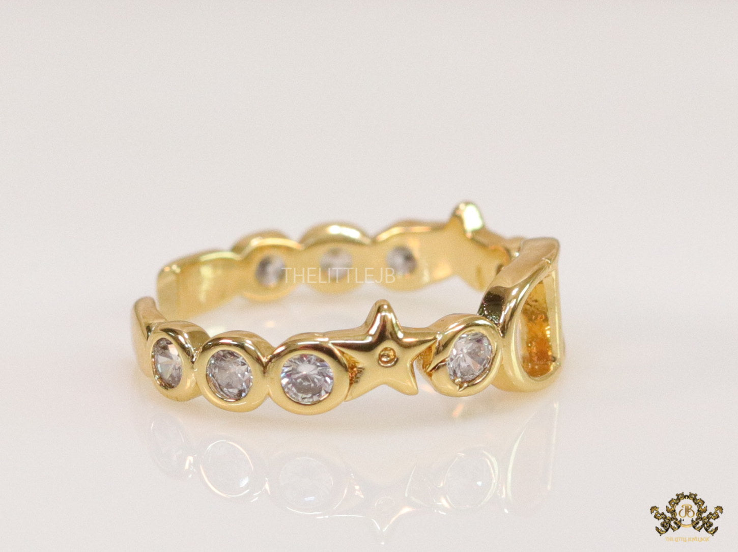 Gold finish alphabet open ring with white cz