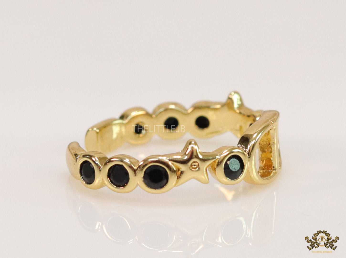 Gold finish alphabet open ring with black cz