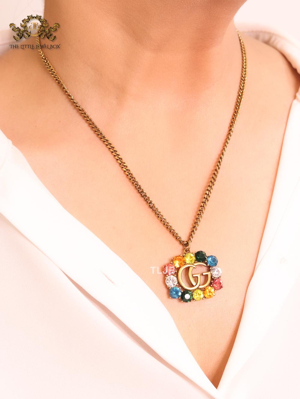 Rustic double g with multicoloured stones