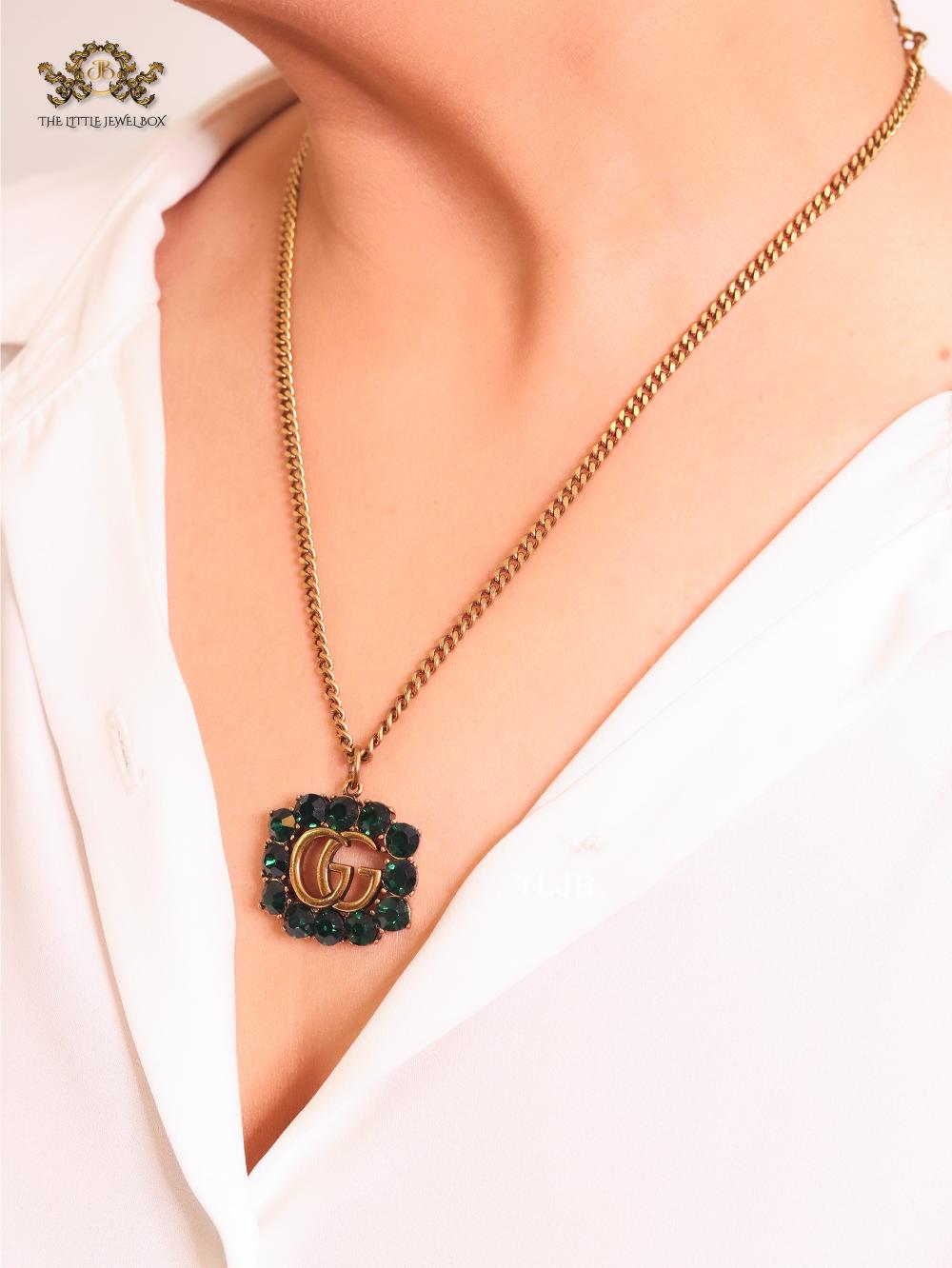 Rustic double g with green stones