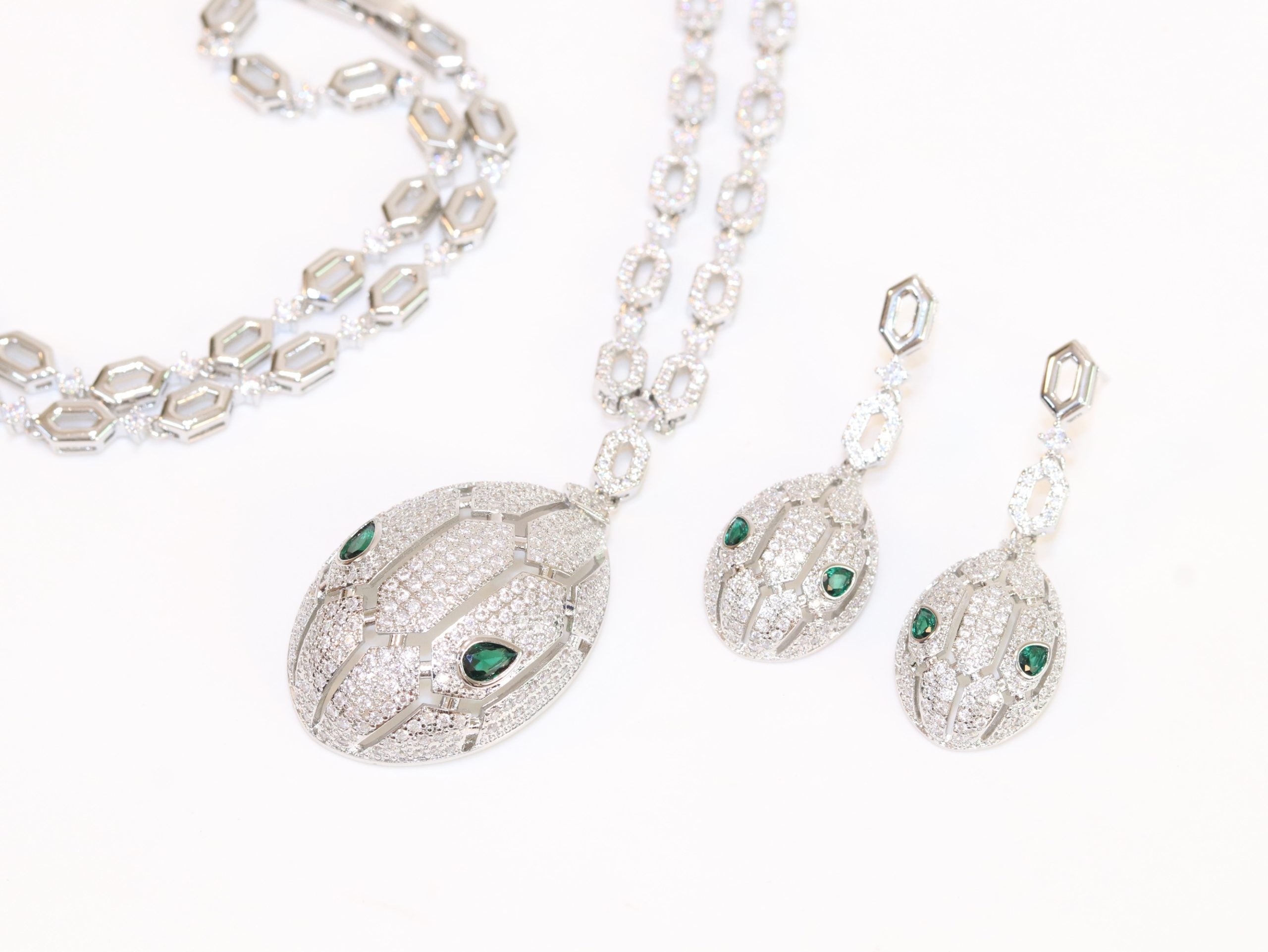 Platinum Snake head pendant set with emerald detailing