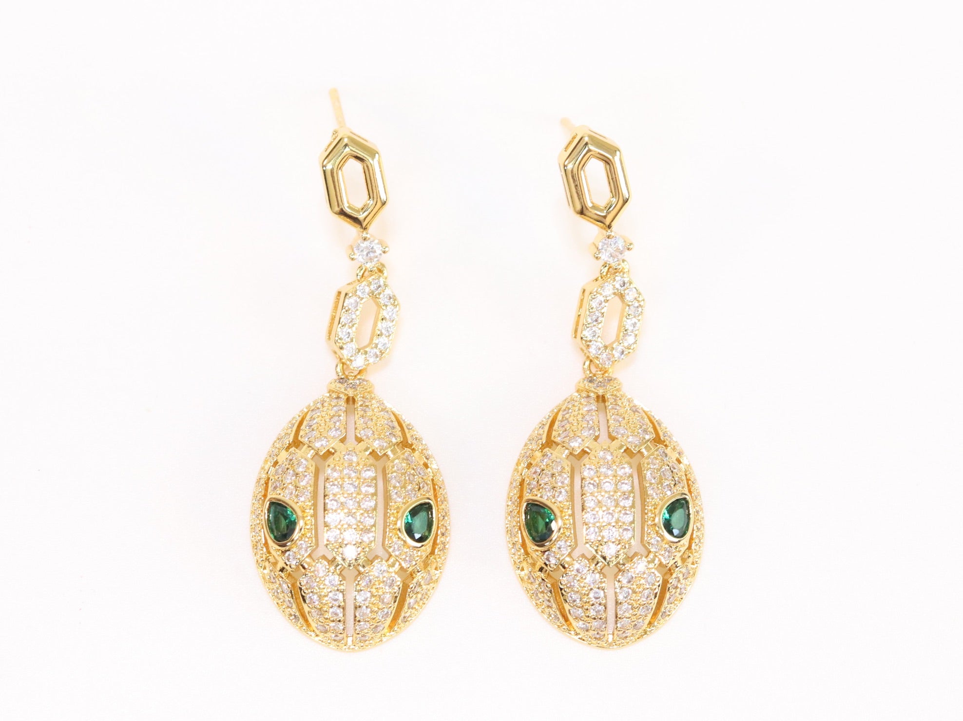 Gold Snake head pendant set with emerald detailing