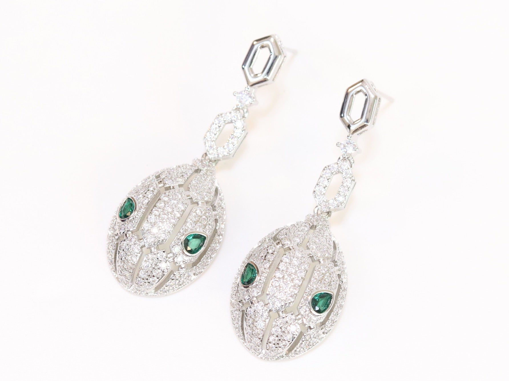 Platinum Snake head pendant set with emerald detailing