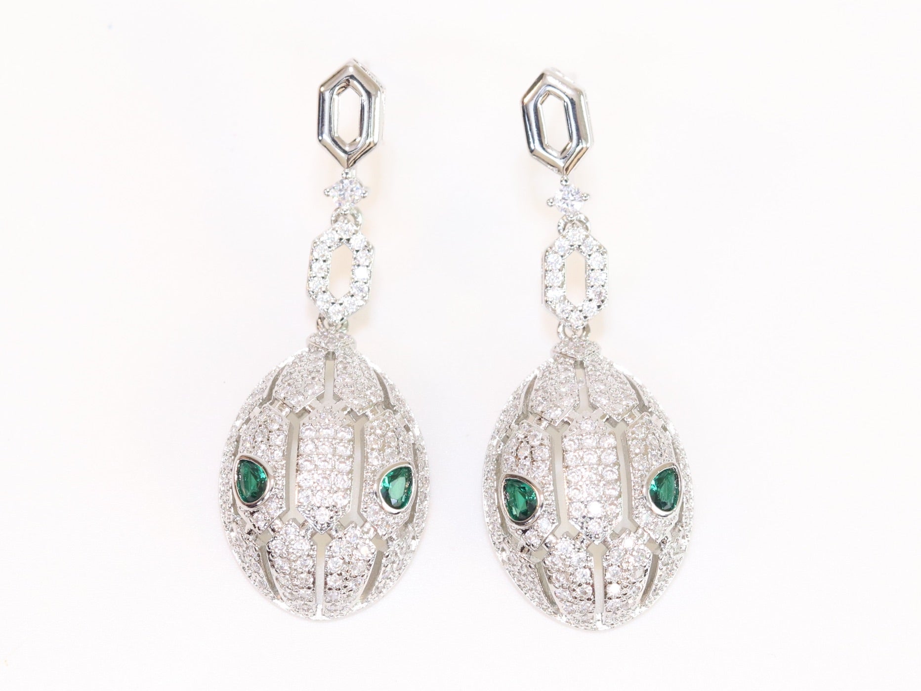 Platinum Snake head pendant set with emerald detailing