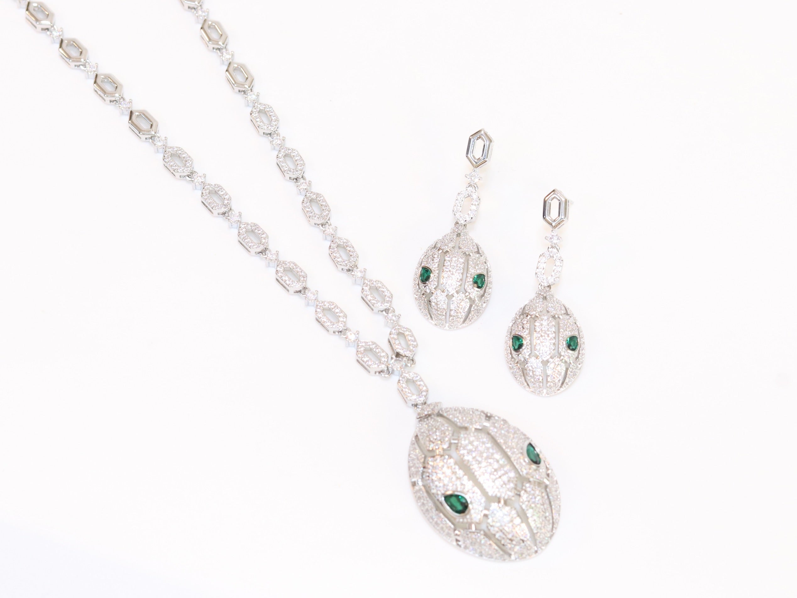 Platinum Snake head pendant set with emerald detailing