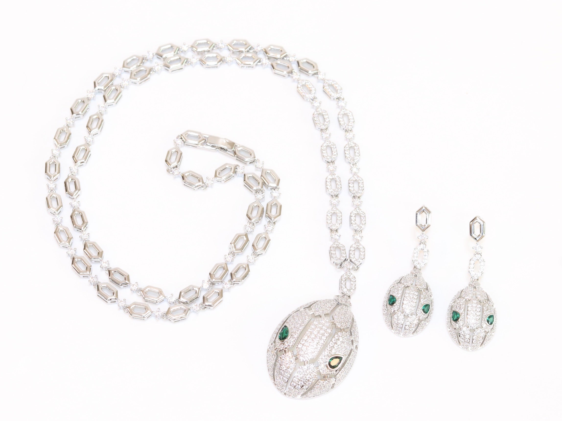 Platinum Snake head pendant set with emerald detailing