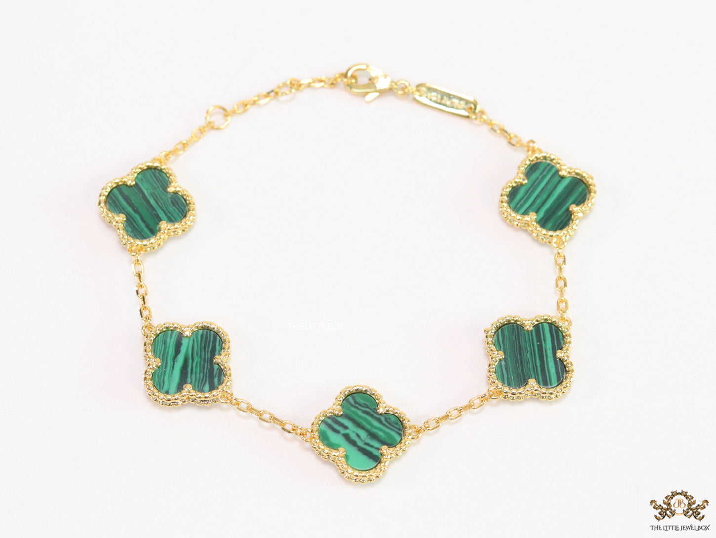 Gold plated chain bracelet with clovers in malachite green