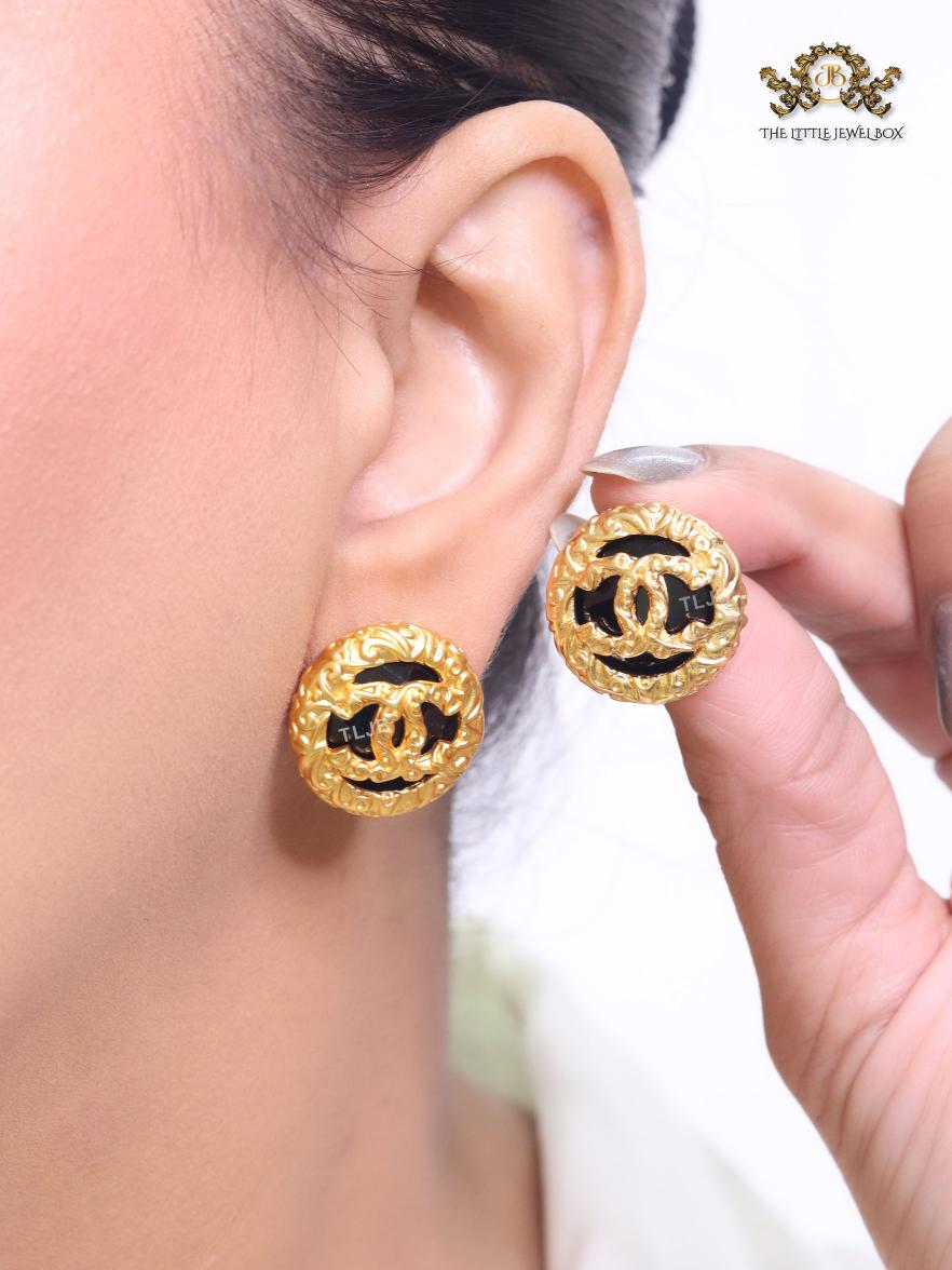 Black and gold double C studs