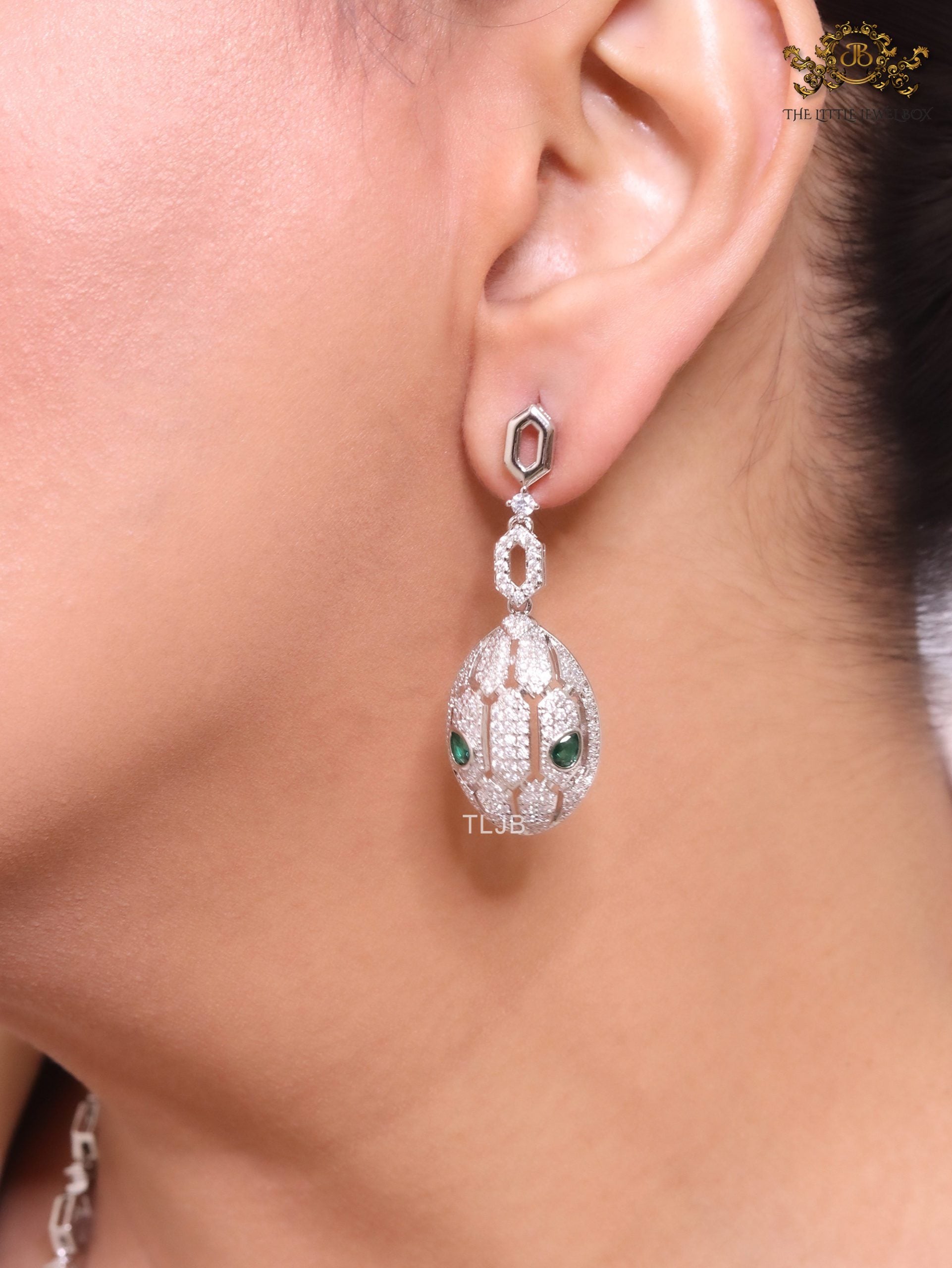 Platinum Snake head pendant set with emerald detailing