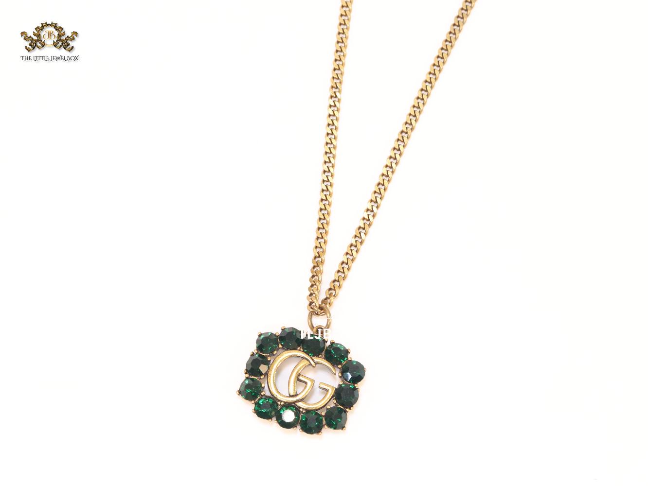 Rustic double g with green stones