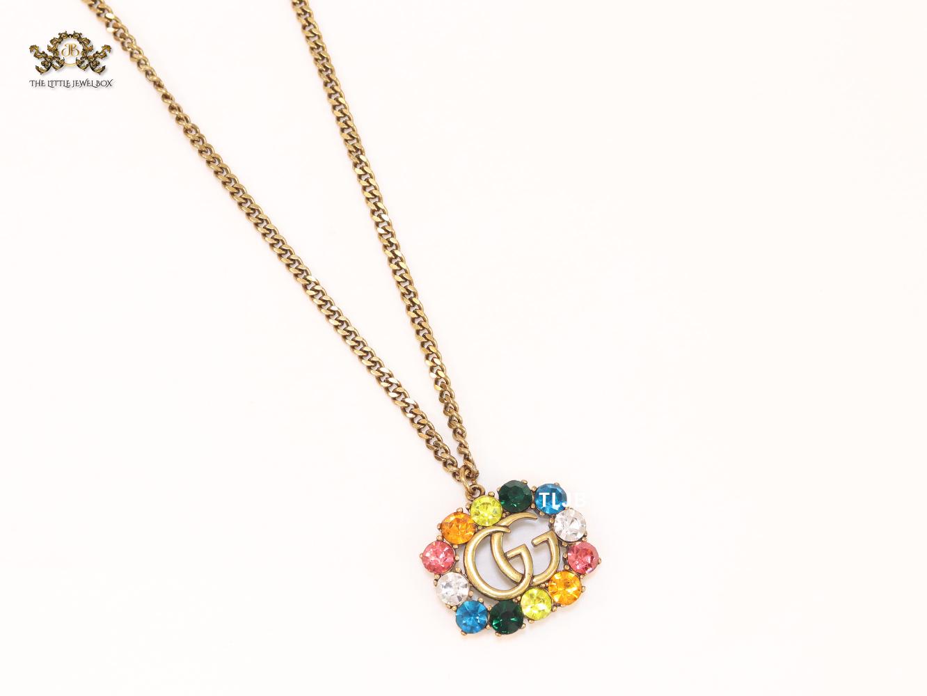 Rustic double g with multicoloured stones