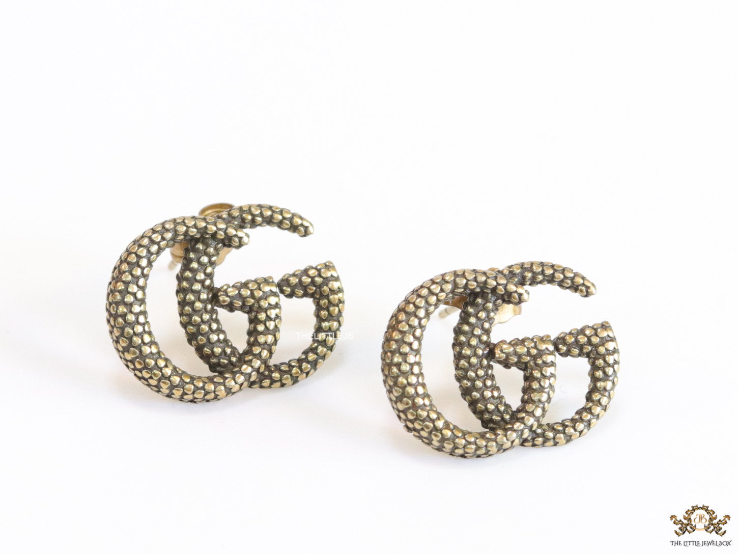 Antique gold plated double G motif studs with honey comb texture