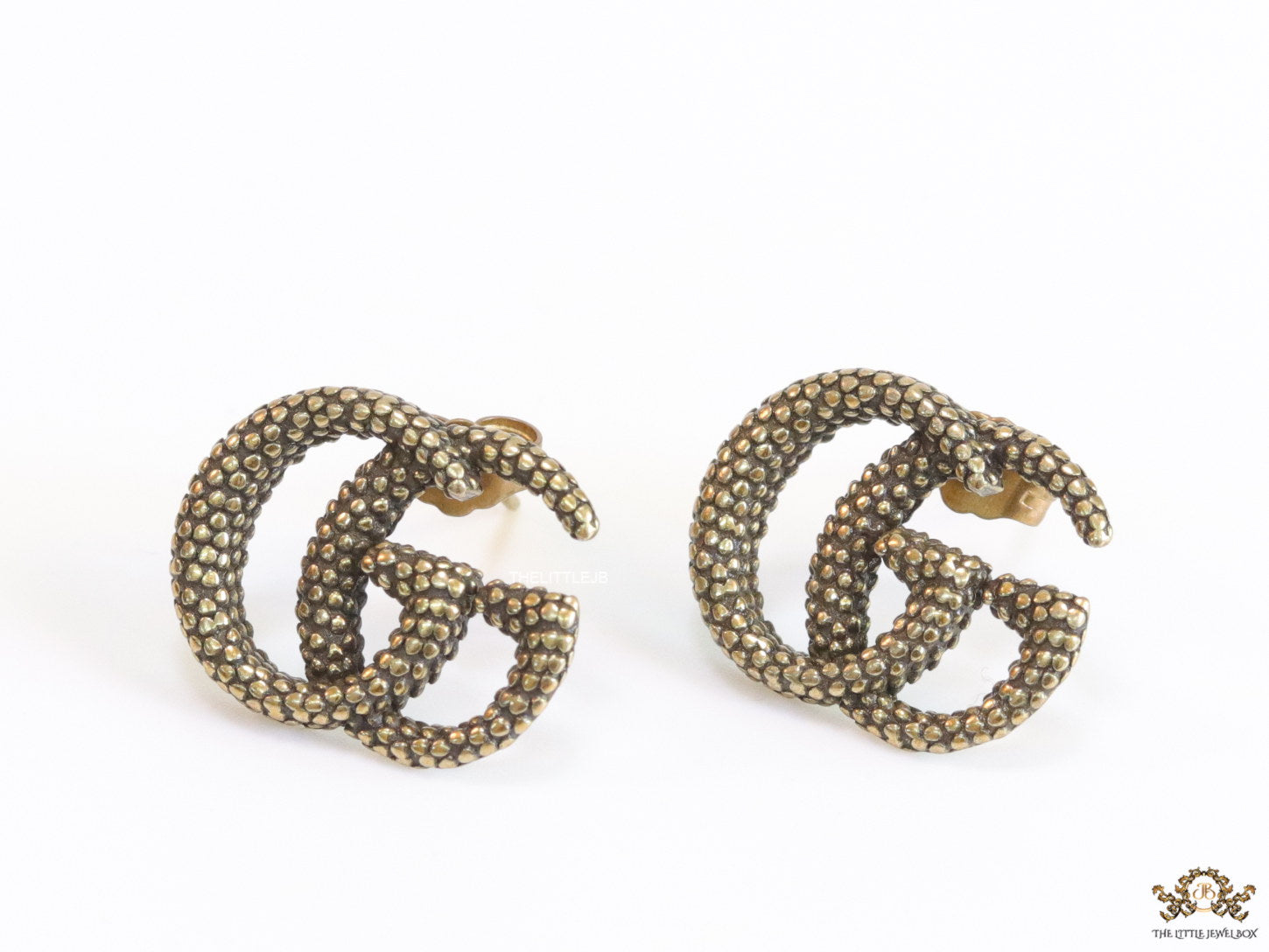 Antique gold plated double G motif studs with honey comb texture