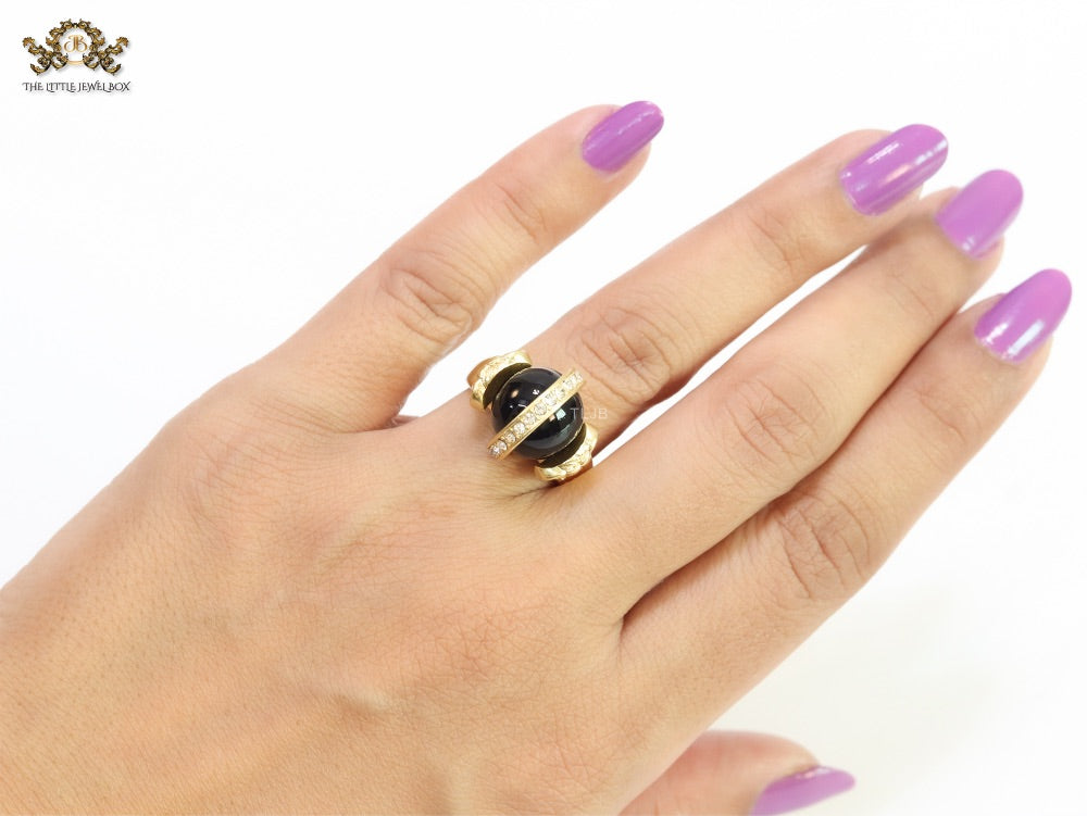 Double gold Medusa with CZ on black ball ring