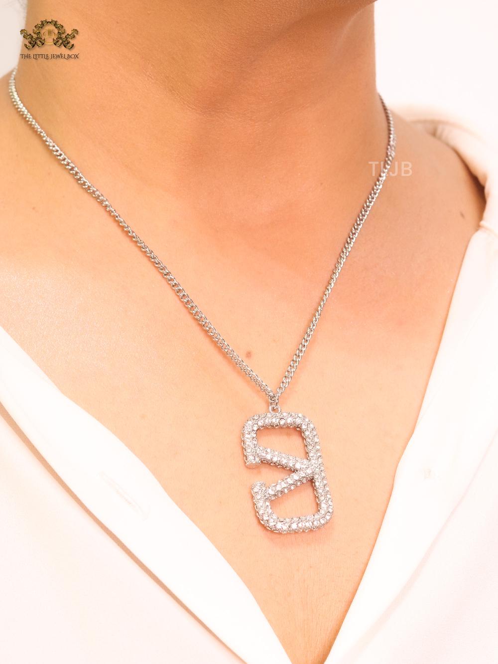 Open V Platinum plated vertical charm pendant with CZ