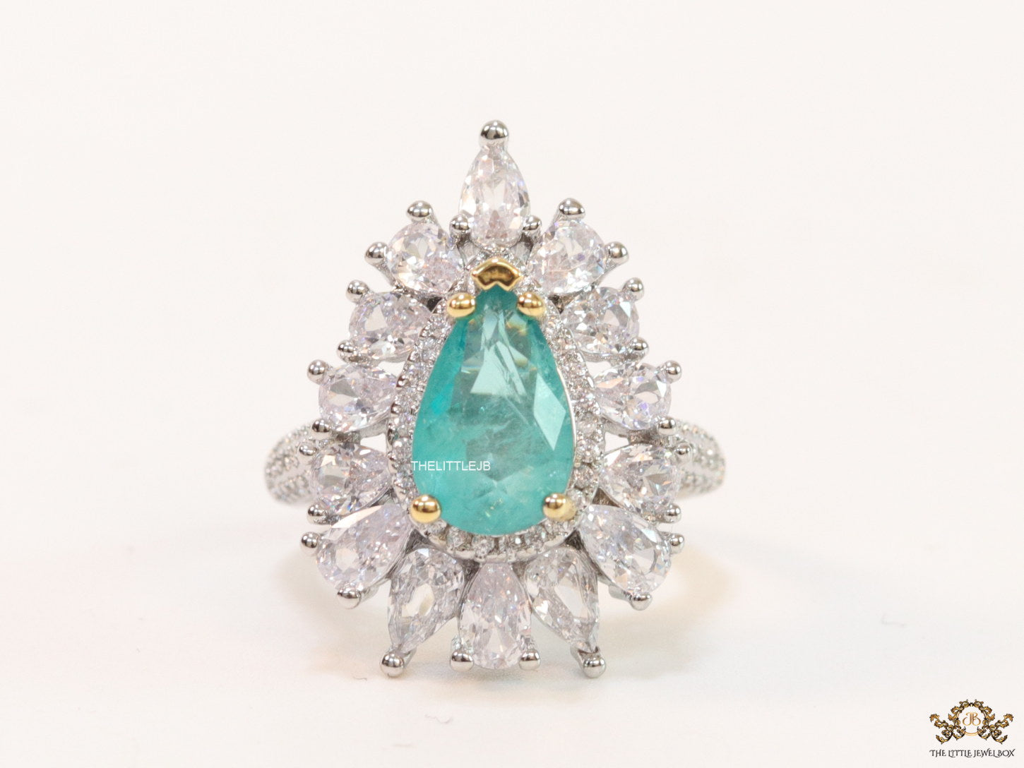 Adjustable drop shape fancy cz ring with green centre and platinum finish