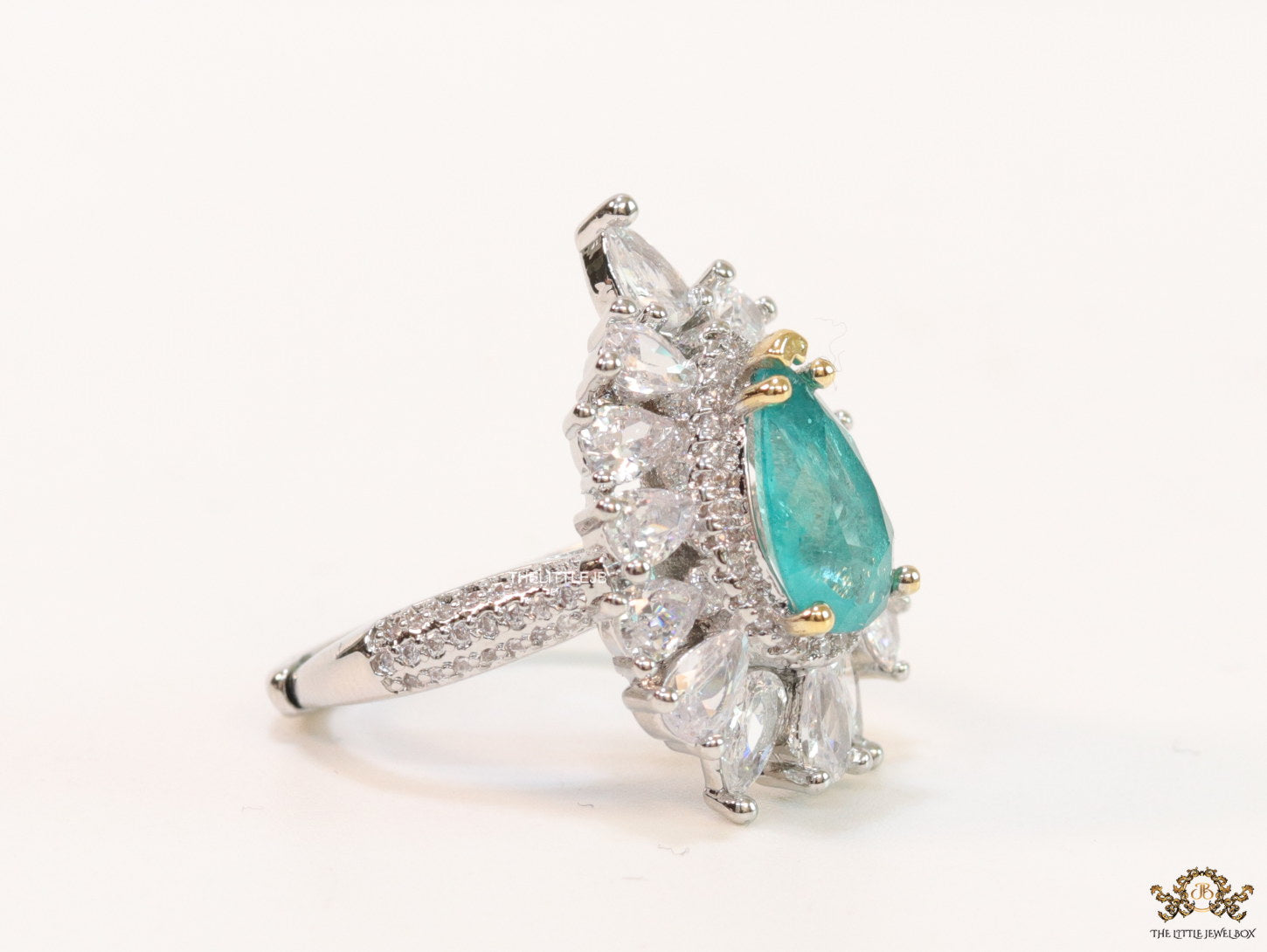 Adjustable drop shape fancy cz ring with green centre and platinum finish