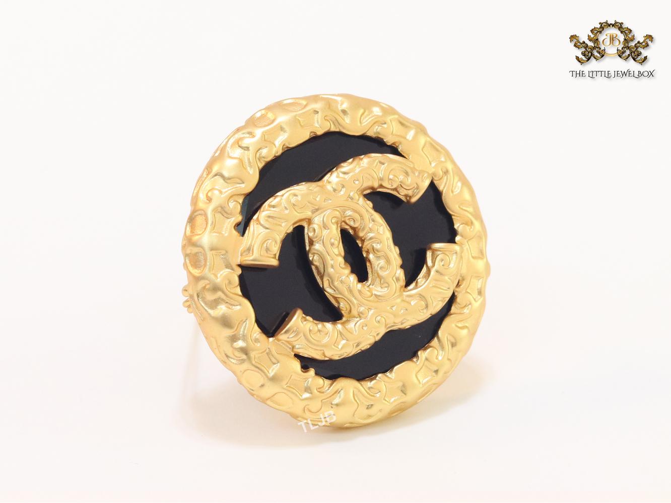 Double C gold foil and black enamel brooch