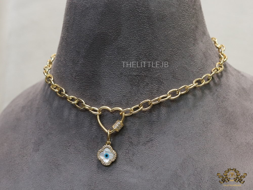 Gold plated link chain necklace with heart shaped lock and evil eye clover pendant