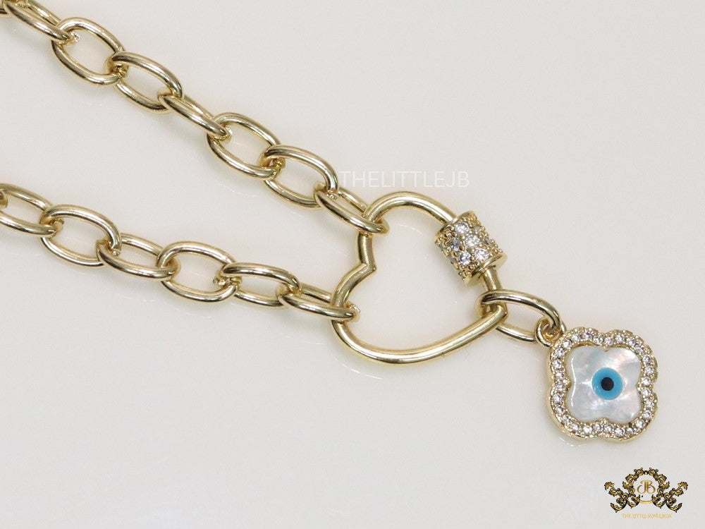 Gold plated link chain necklace with heart shaped lock and evil eye clover pendant