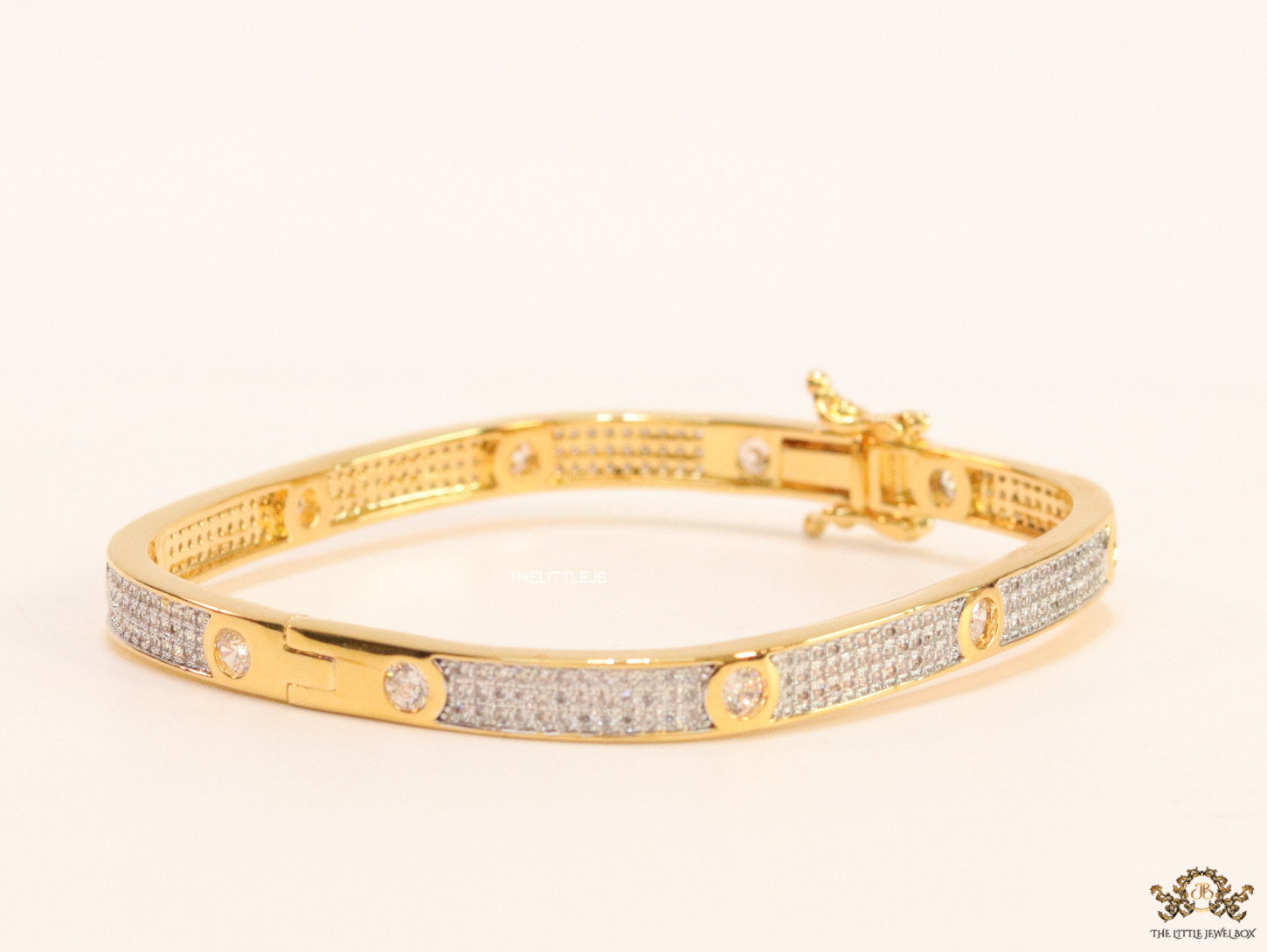 Gold plated openable bracelet studded with cz