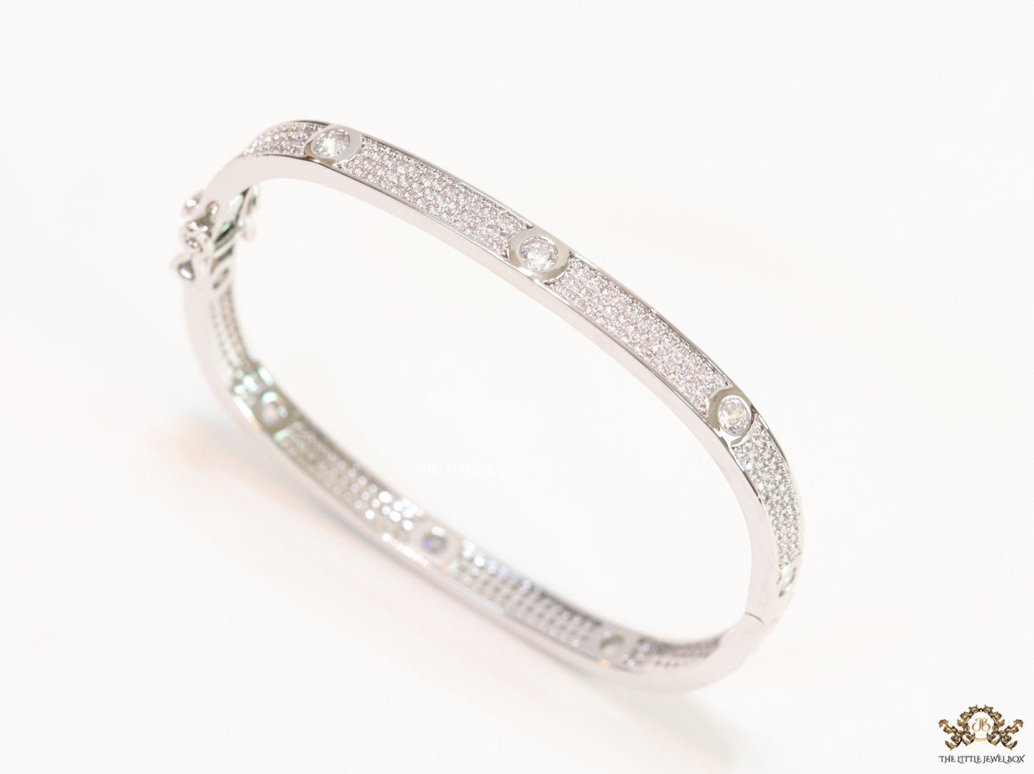 Platinum plated openable bracelet studded with cz