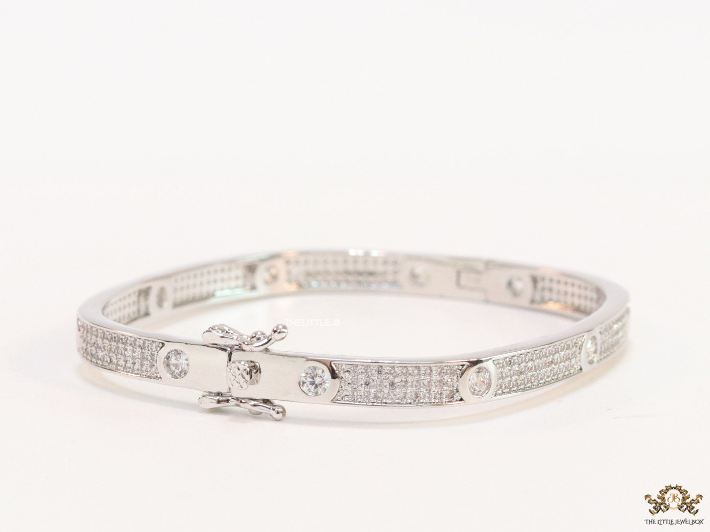 Platinum plated openable bracelet studded with cz