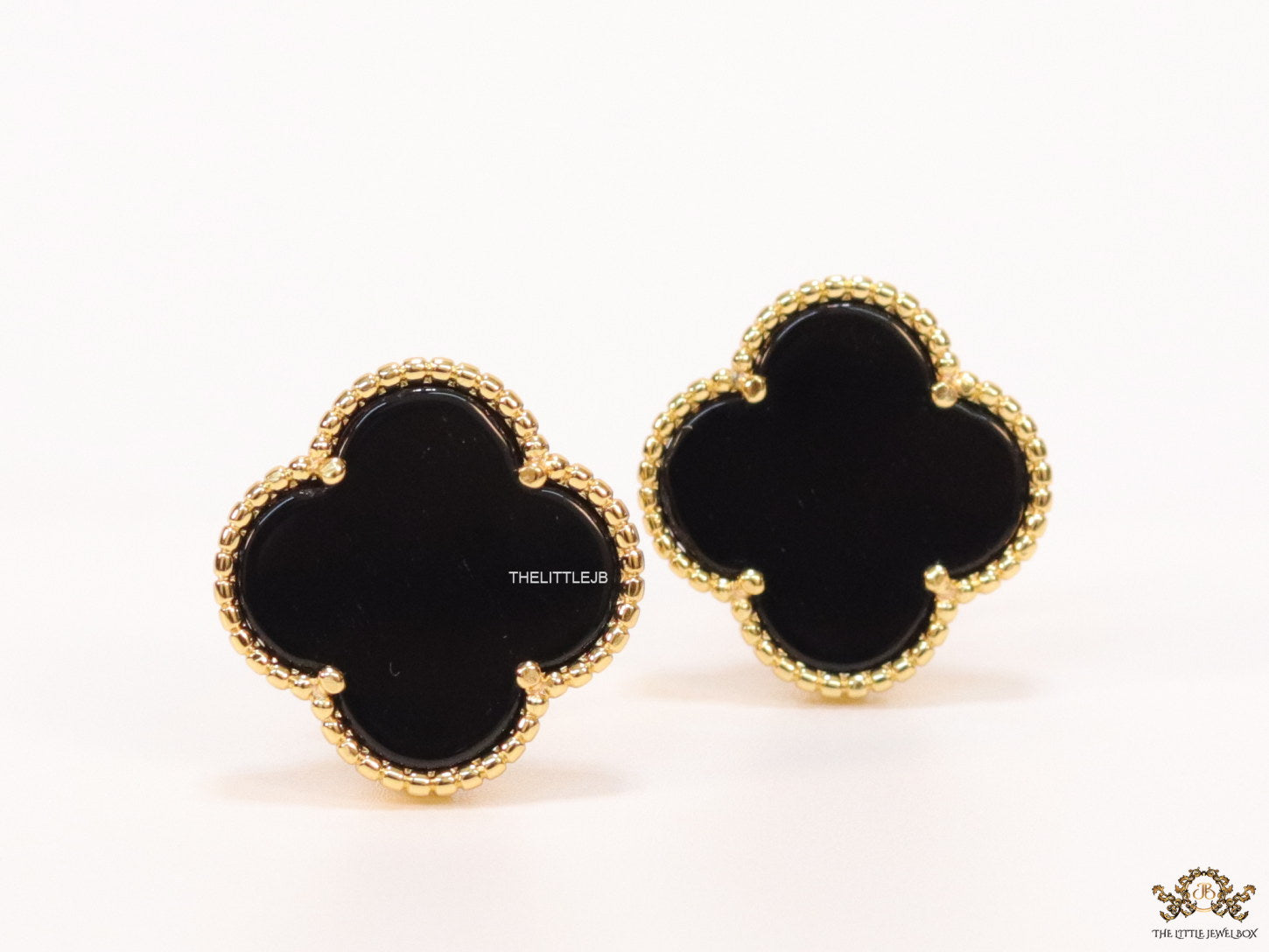 Black clover stud earrings in gold plating