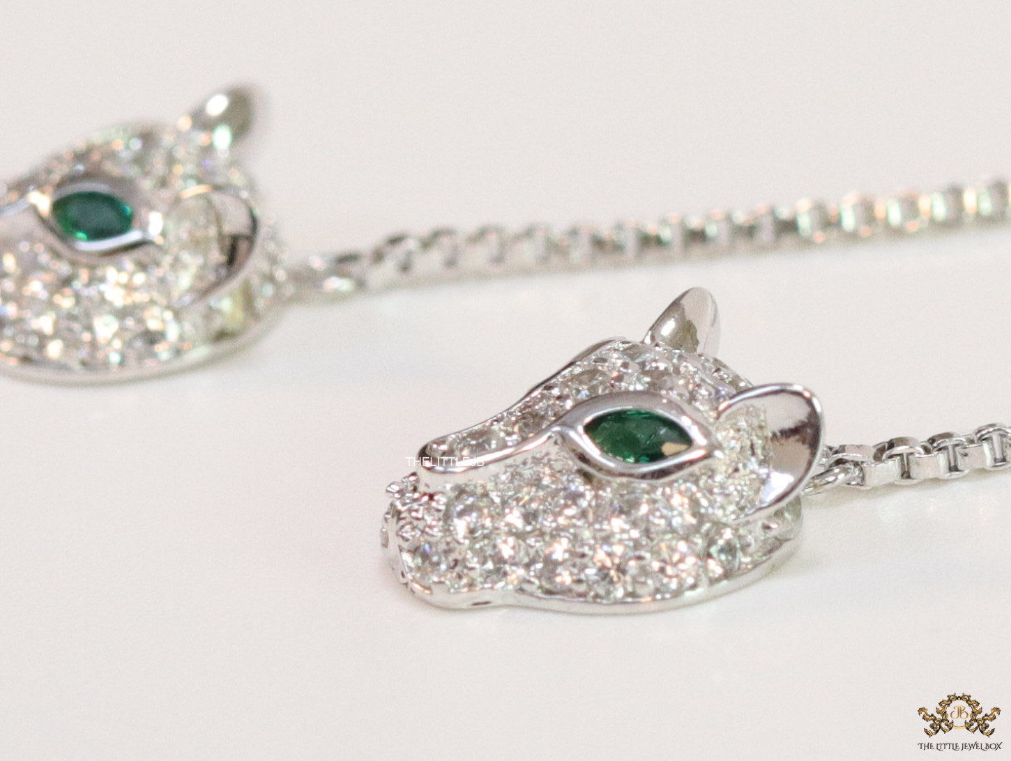 Platinum plated knot necklace with twin cz panther pendants