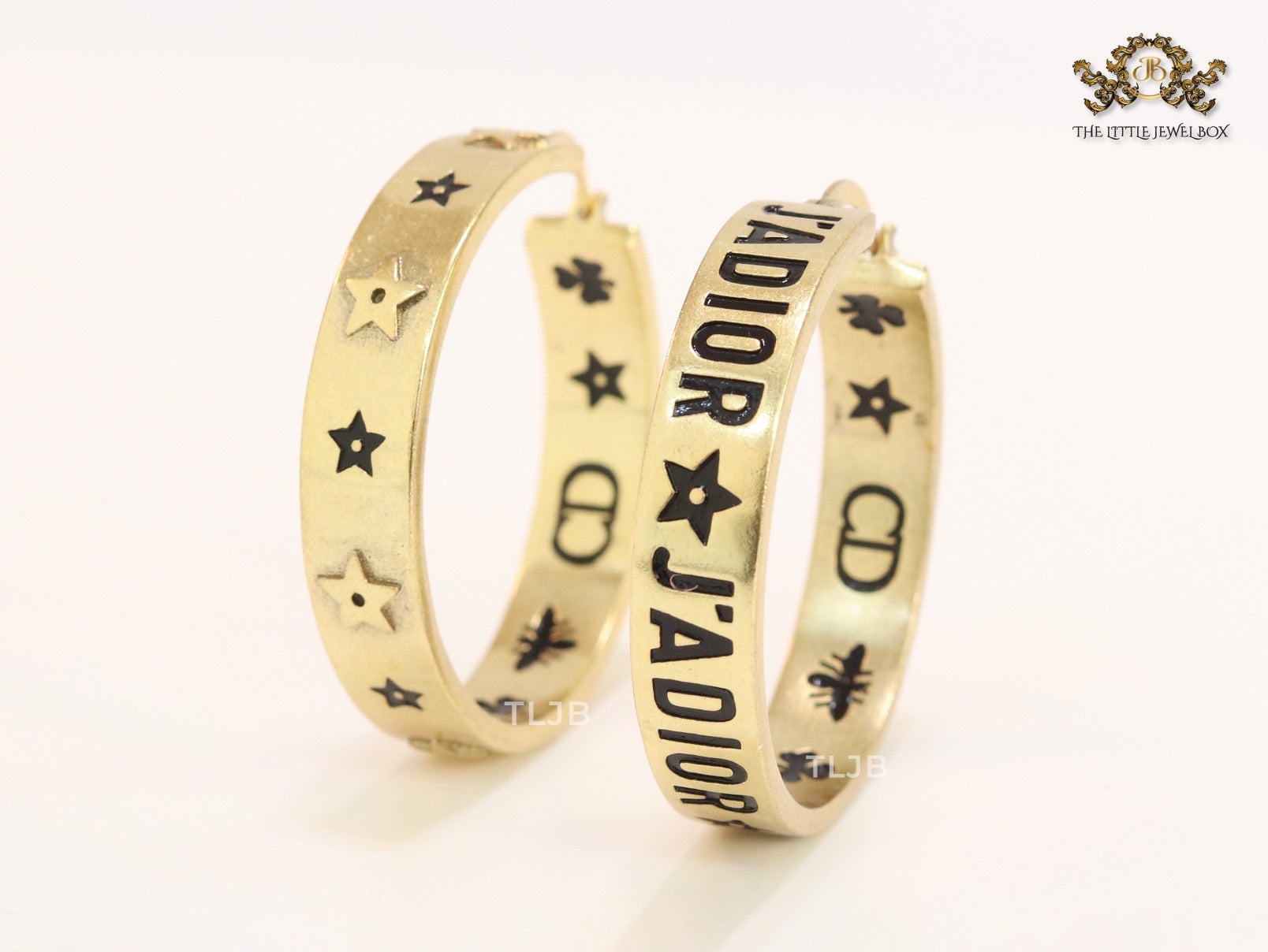 Alphabet C and D embossed on gold hoops