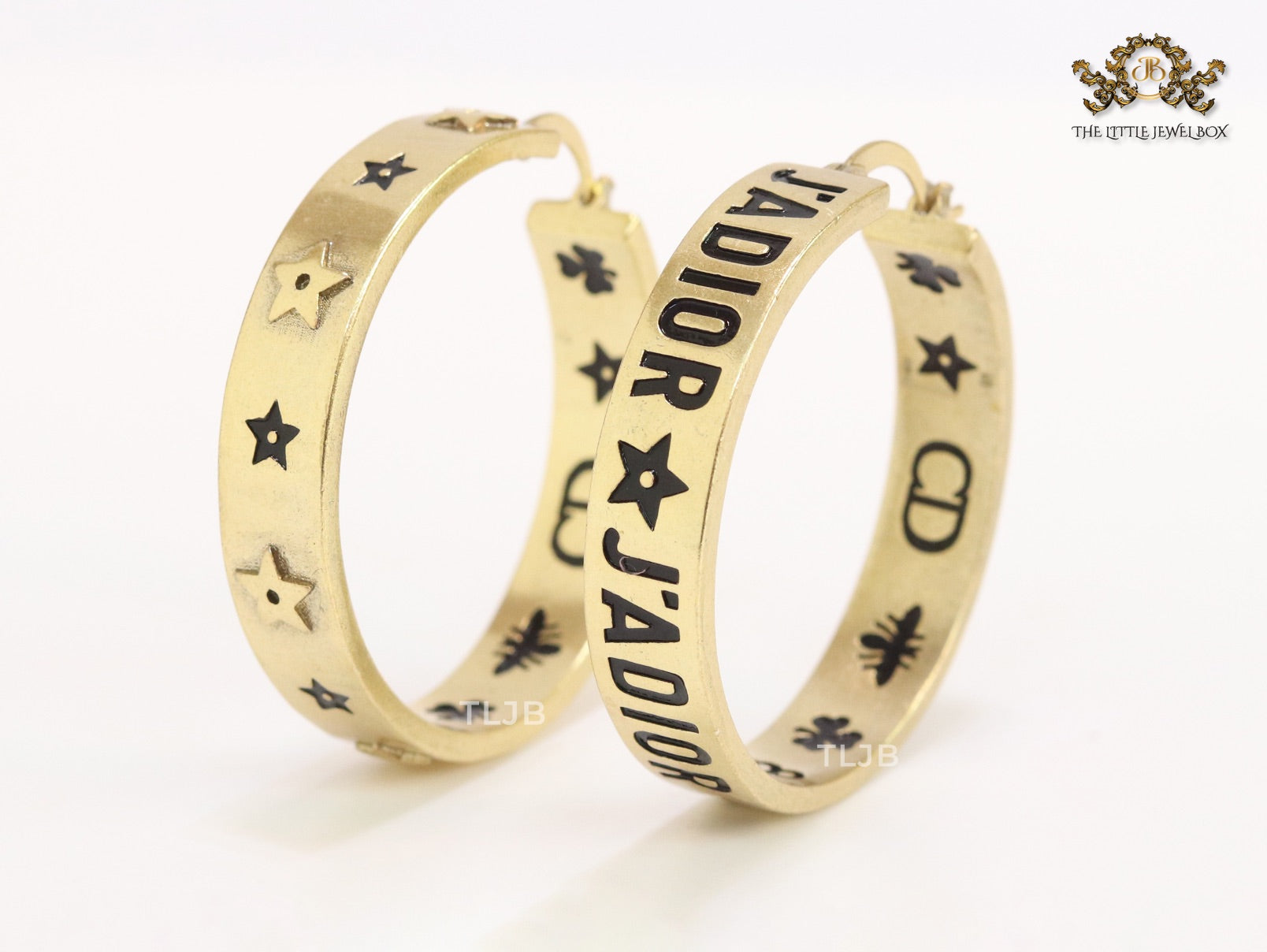 Alphabet C and D embossed on gold hoops