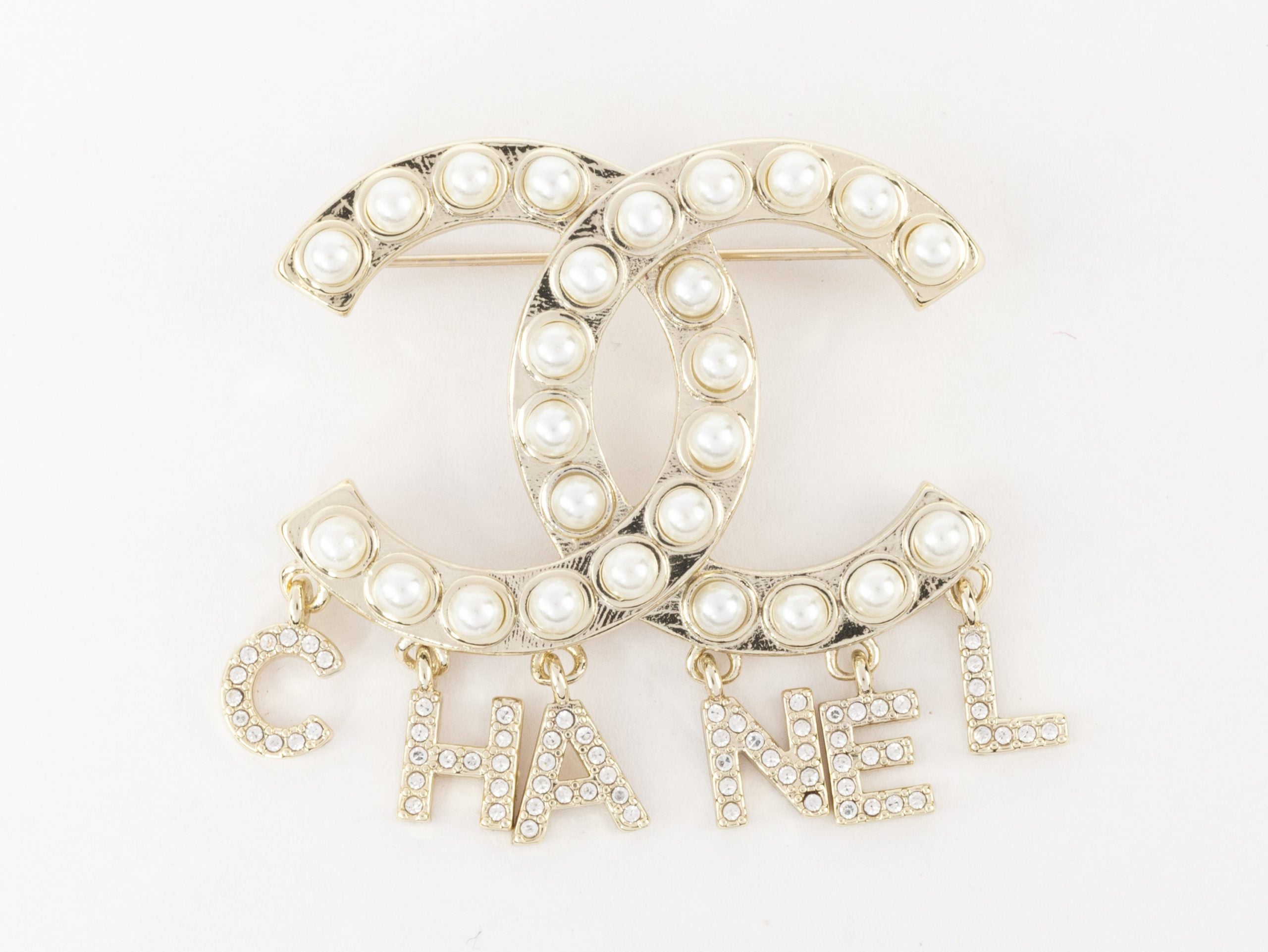 Platinum Double C pearl brooch with charms