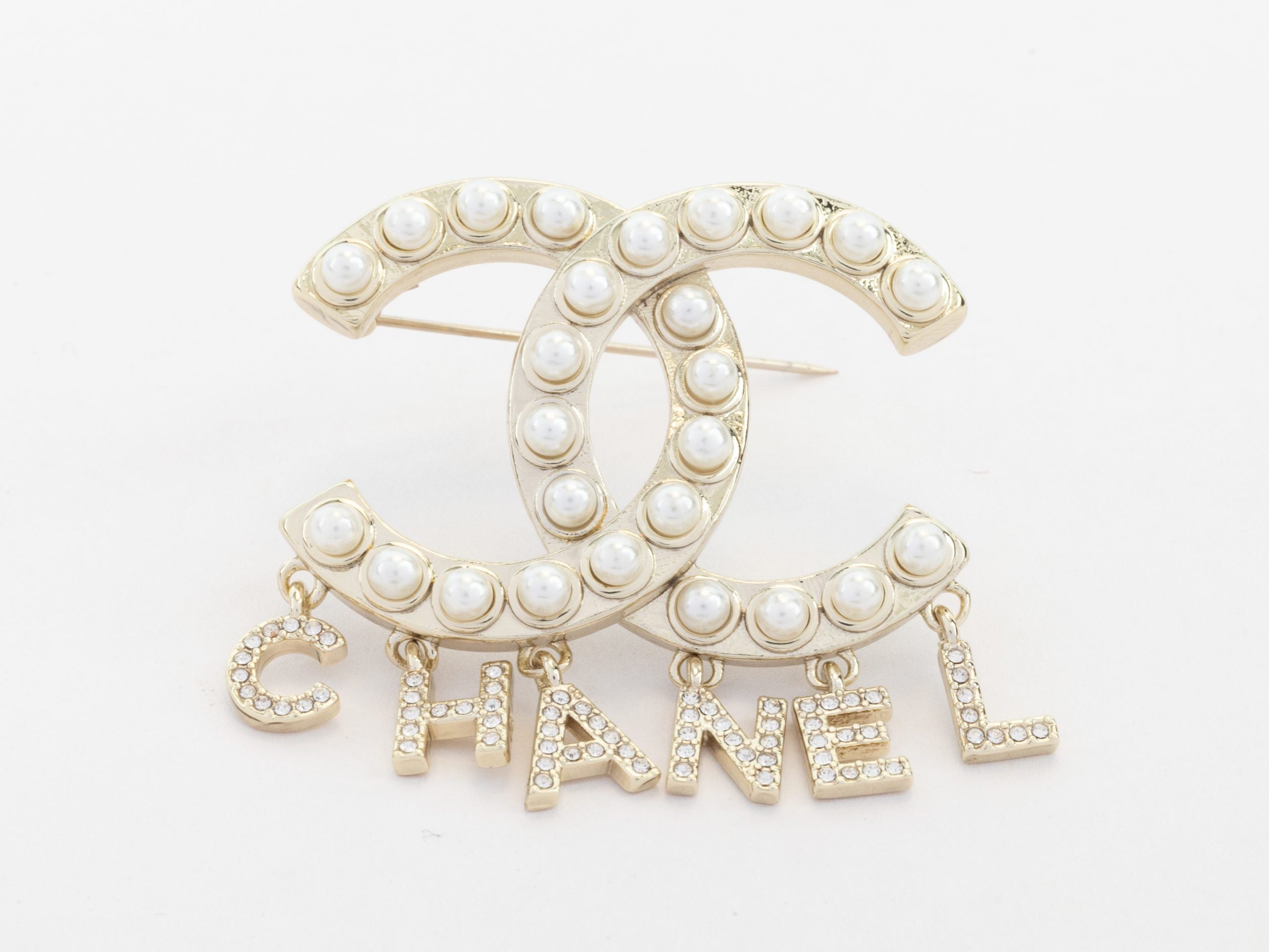 Platinum Double C pearl brooch with charms