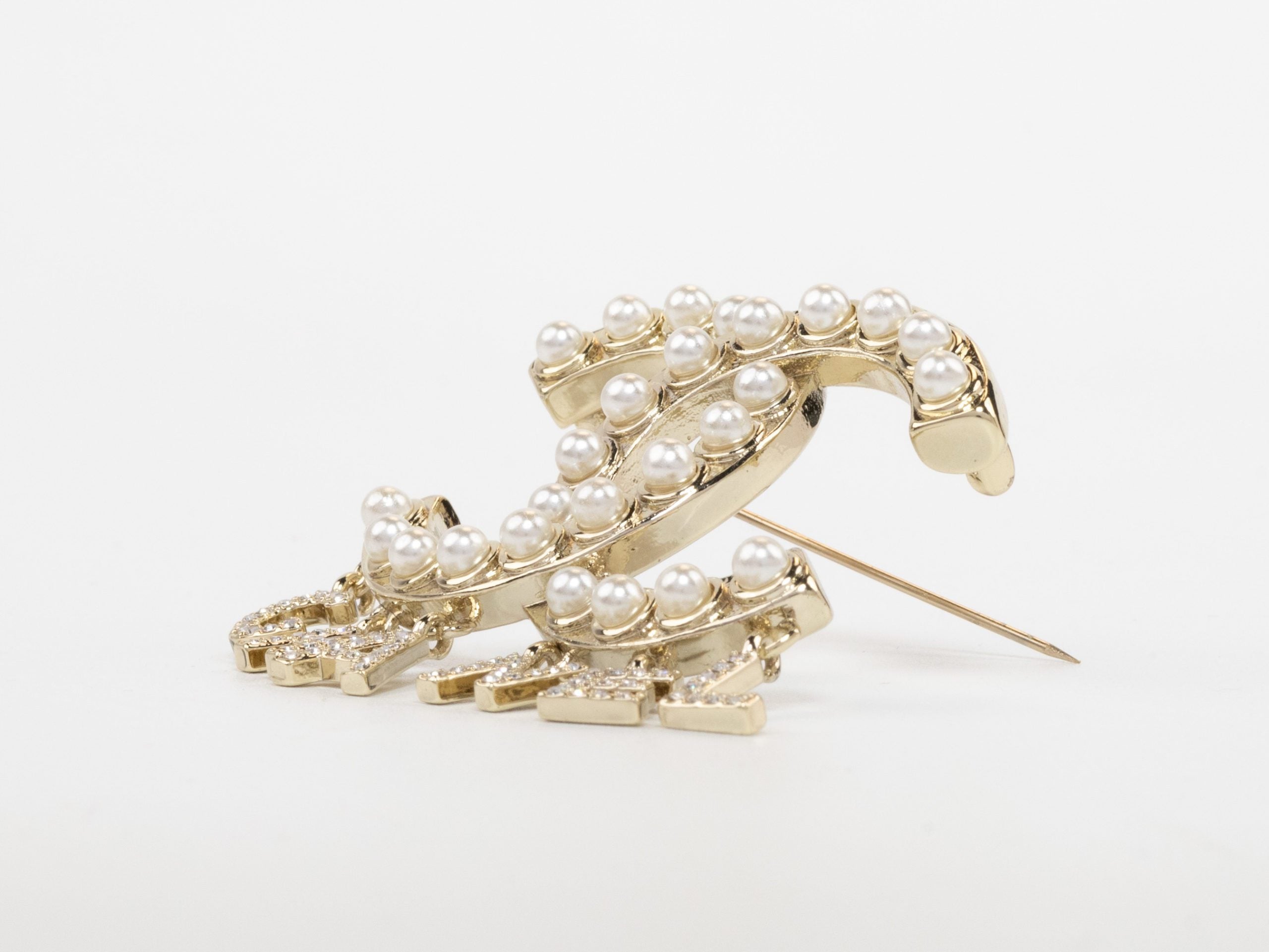 Platinum Double C pearl brooch with charms